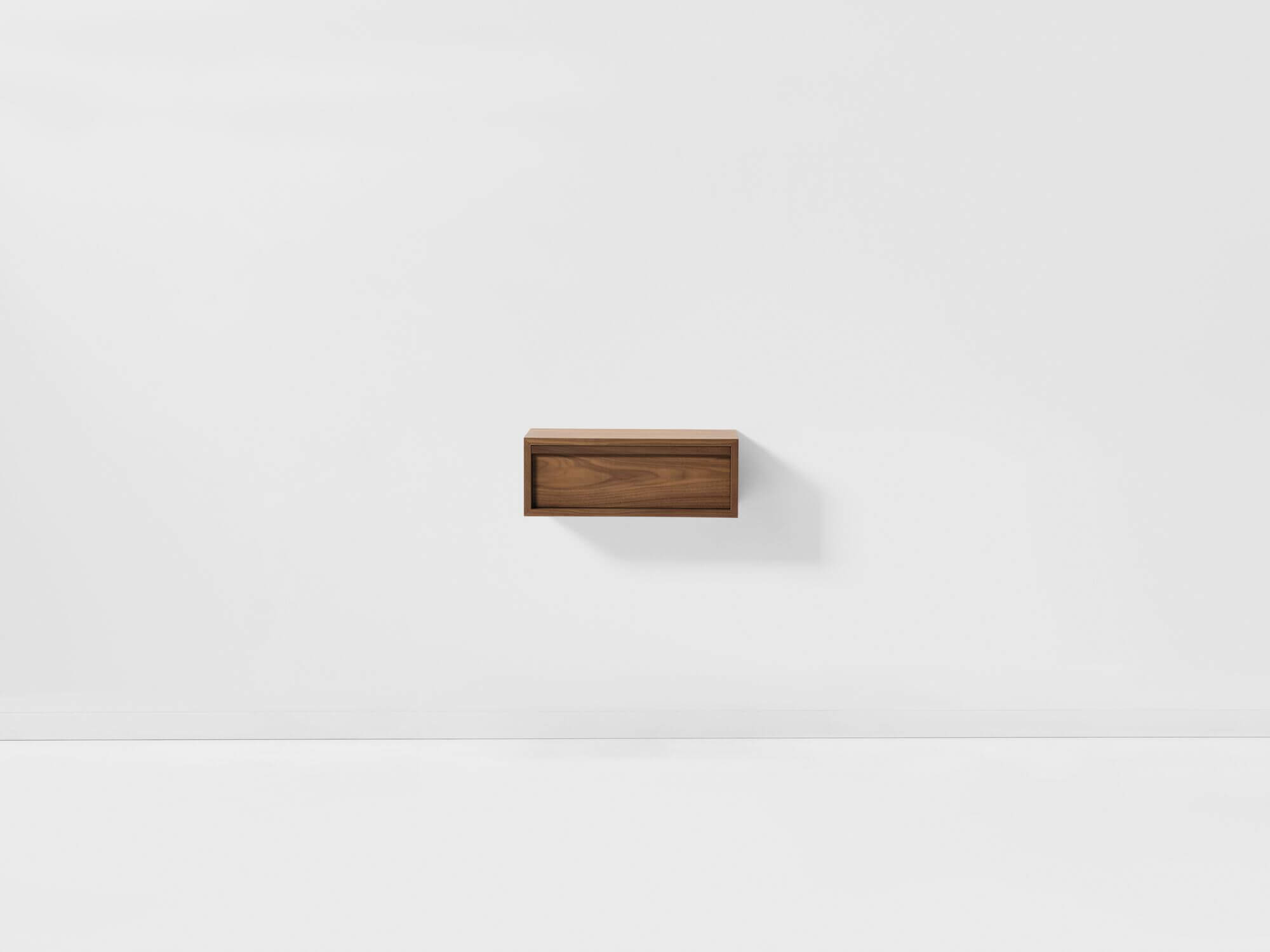 Front view of modern walnut floating nightstand